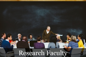 Research Faculty Professor teaches in front of empty chalkboard